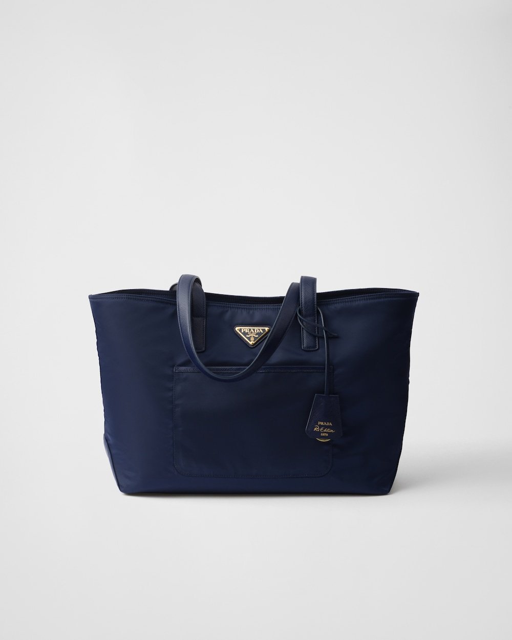 6342ddc18c104ff59b1a6089e1188c81.jpg Prada Re-Edition 1978 Medium Re-Nylon and Saffiano Leather Tote Bag - Image 1