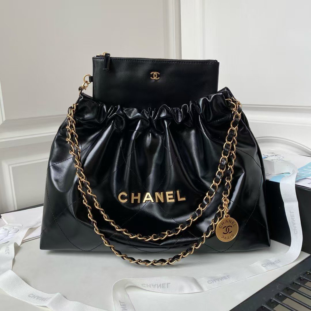 6b451215e0304685a84f1f9809c5e643.jpg Chanel 22 Hobo Bag 24C AS4486 Gold Metallic Black Shiny Calfskin New Edition Horizontal - Image 1