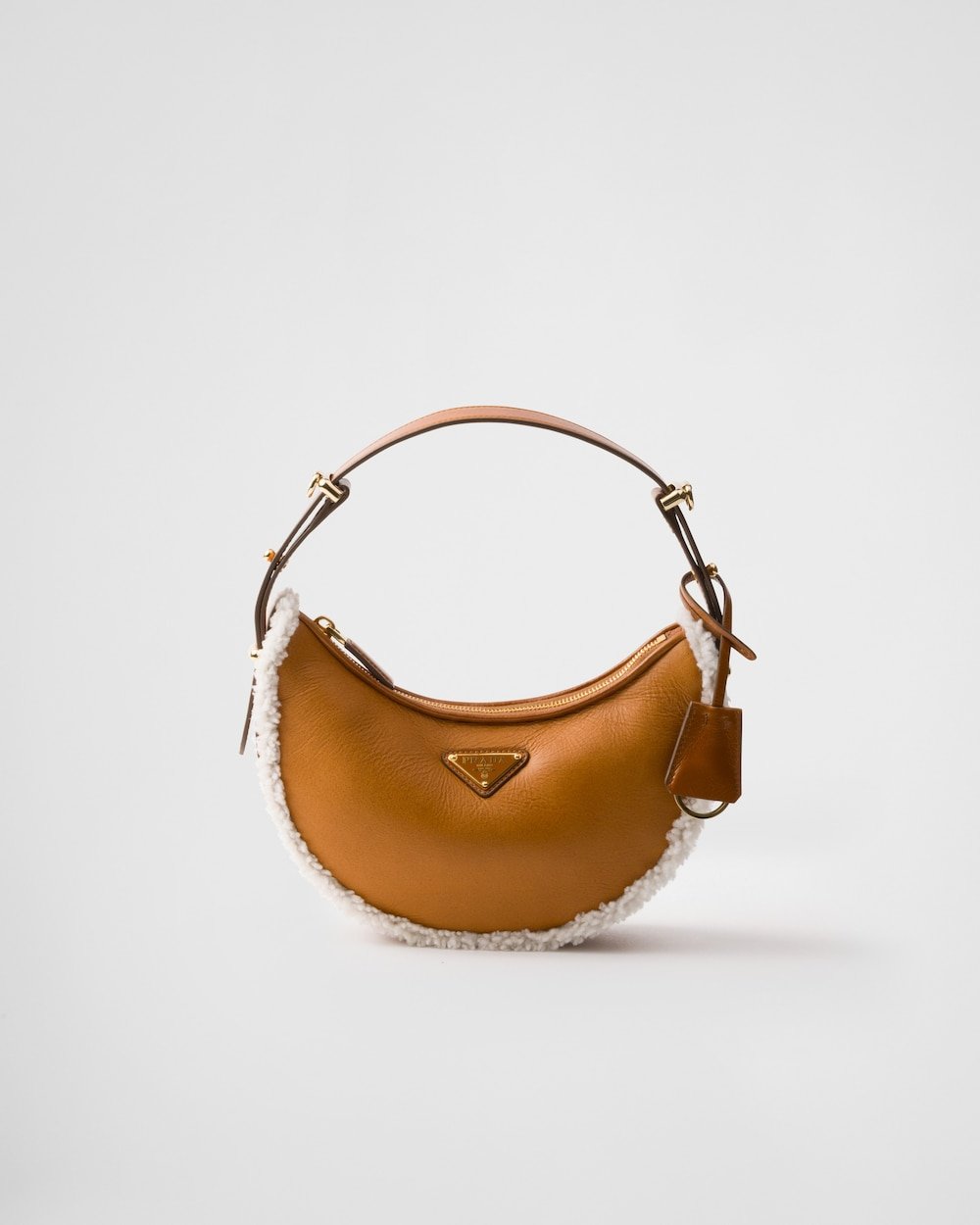 7efbb786de394825951db3847b1ecf79.jpg Prada Arqué Small Shearling Shoulder Bag - Image 1