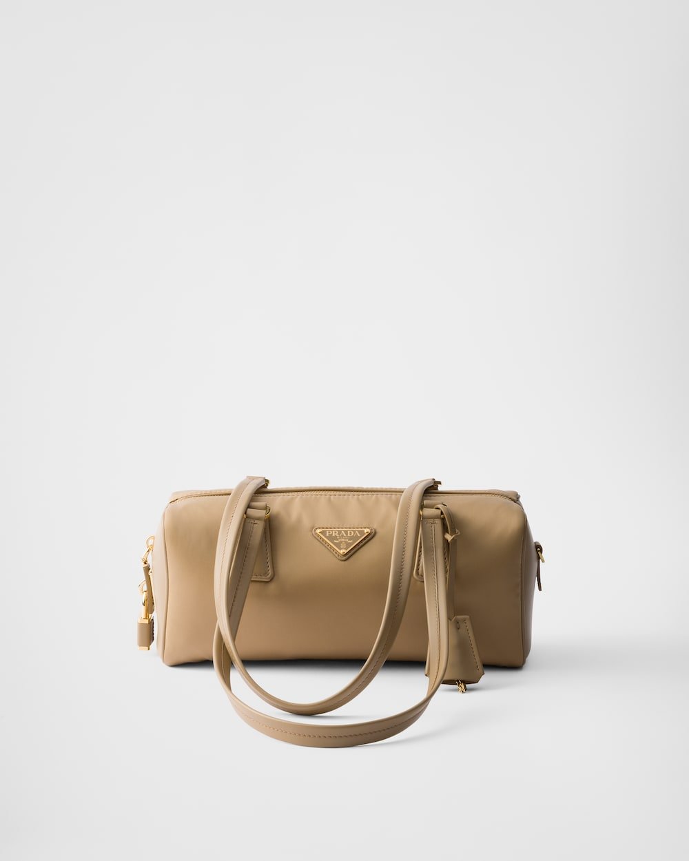 9f5b9e44f0514565a86823615b8f6797.jpg Re-Nylon and Leather Medium Top-Handle Bag With Padlock - Image 1